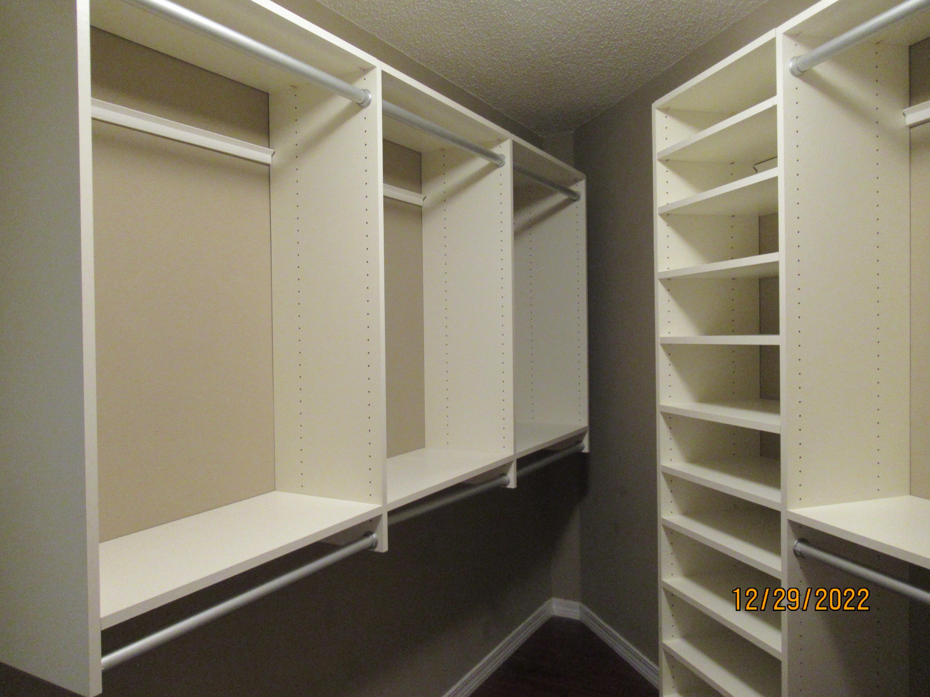 173 South Harborview Road Santa Rosa Beach, FL 32459 - Photo 9 of 24 a view of walk in closet with empty racks
