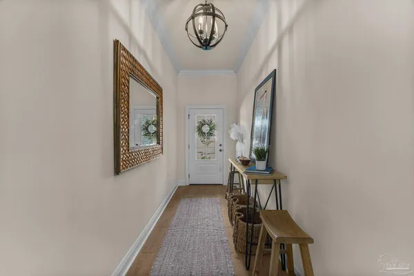 a living room with furniture and a view of kitchen