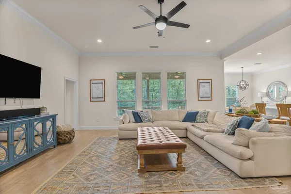 a large kitchen with stainless steel appliances lots of counter space and wooden floor
