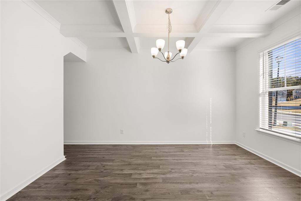 1915 Endress Circle Hampton, GA 30228 - Photo 11 of 42 a view of empty room with wooden floor and window
