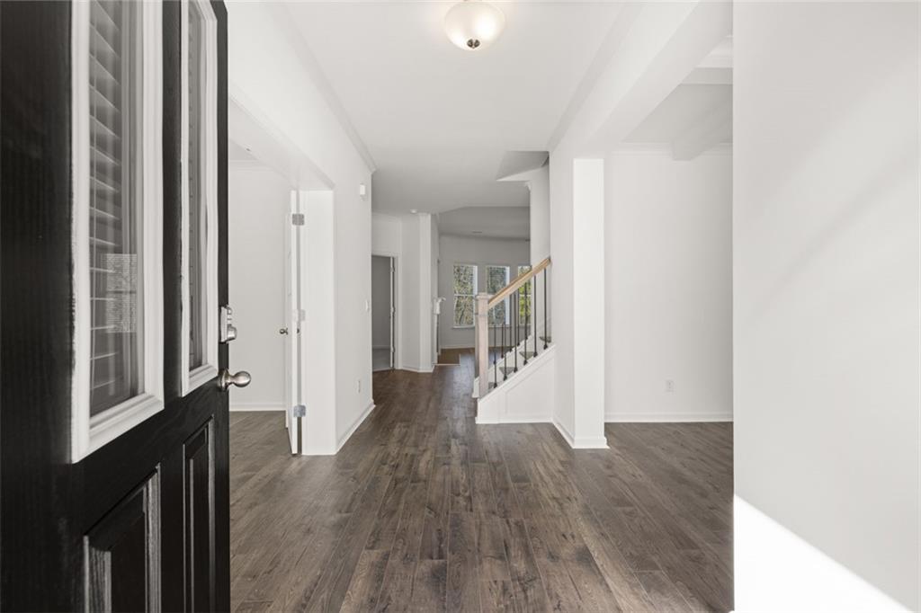 1915 Endress Circle Hampton, GA 30228 - Photo 3 of 42 a view of a hallway with wooden floor