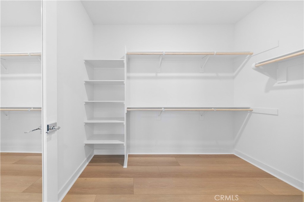 312 Tank Irvine, CA 92618 - Photo 42 of 75 a view of walk in closet with empty racks
