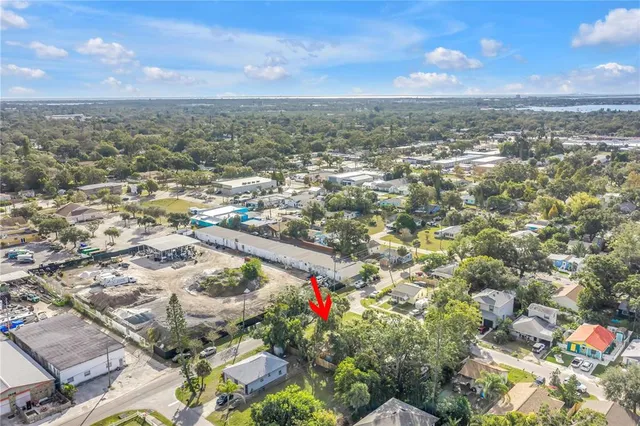 an aerial view of city and lake