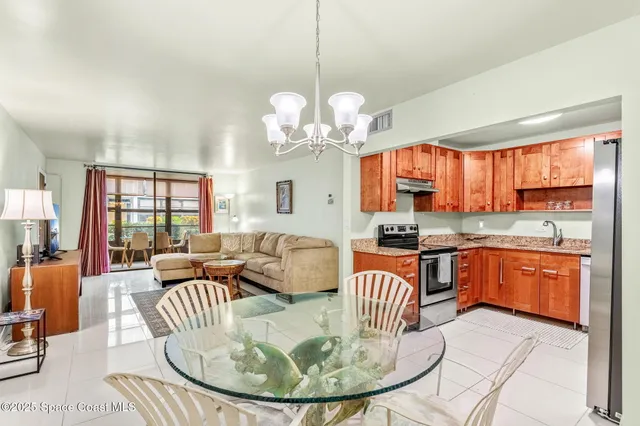 a view of a kitchen with granite countertop a stove top oven