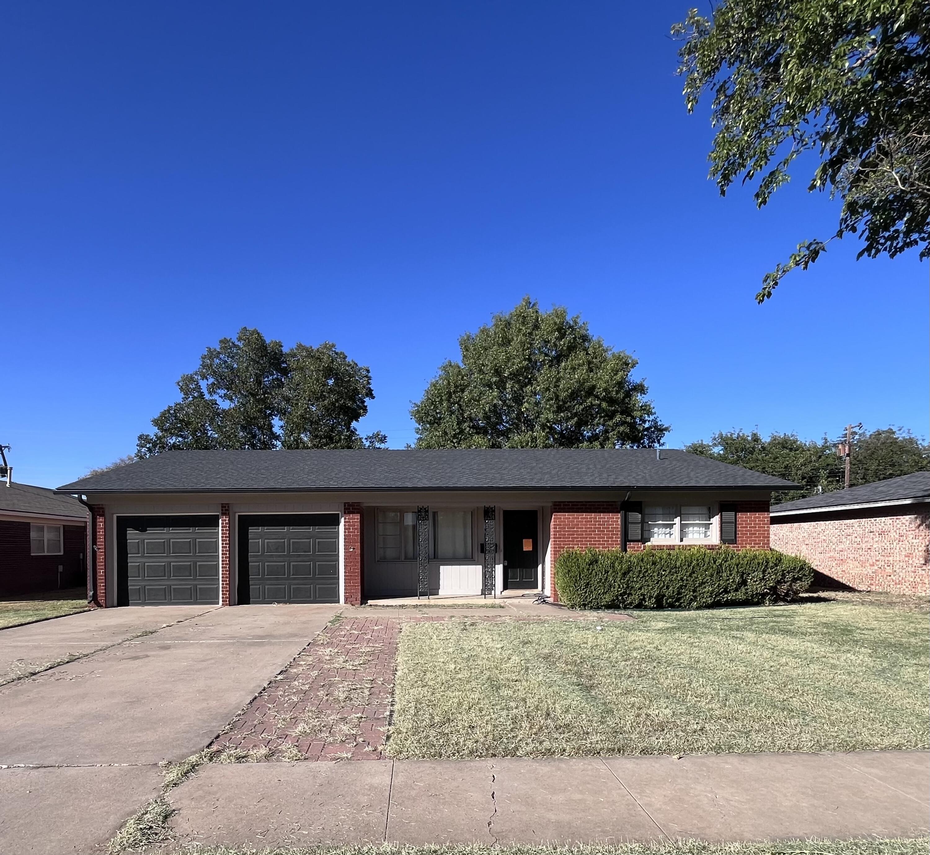 3612 55th Street Lubbock, TX 79413 - Photo 1 of 28 front view of house with a yard