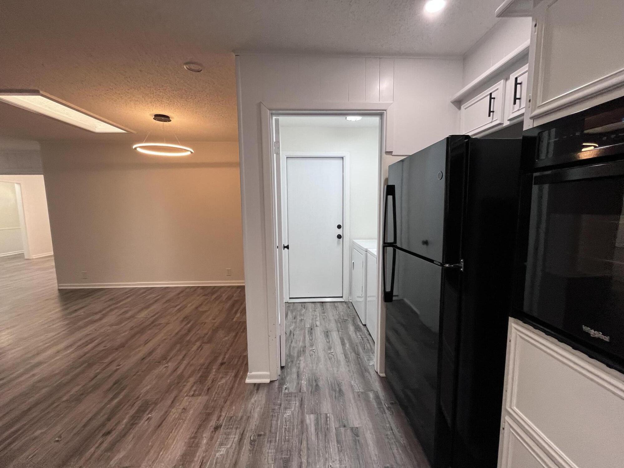 3612 55th Street Lubbock, TX 79413 - Photo 12 of 28 a view of hallway with wooden floor