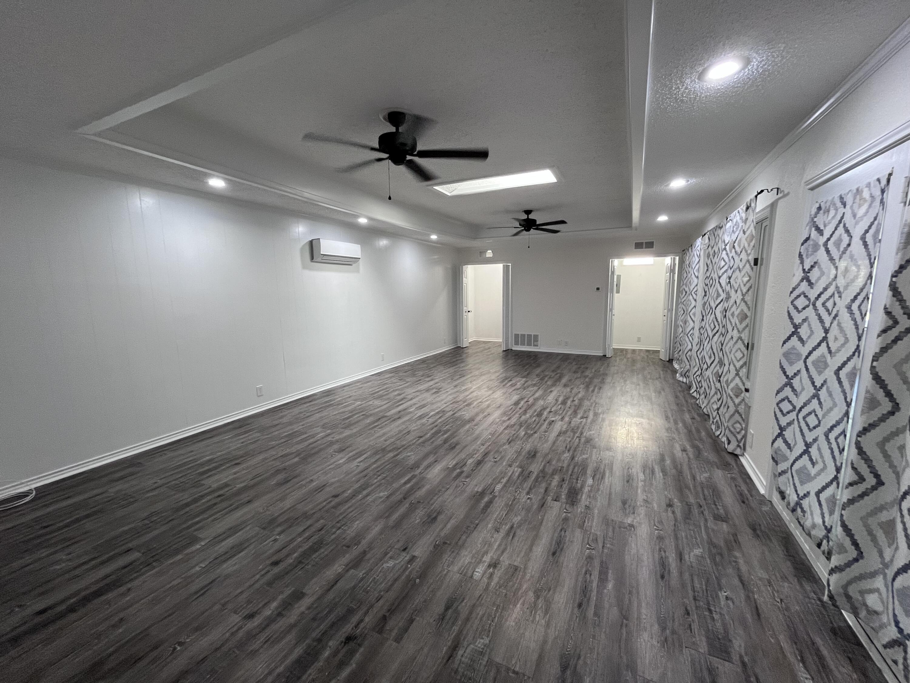 3612 55th Street Lubbock, TX 79413 - Photo 13 of 28 a view of an empty room and wooden floor