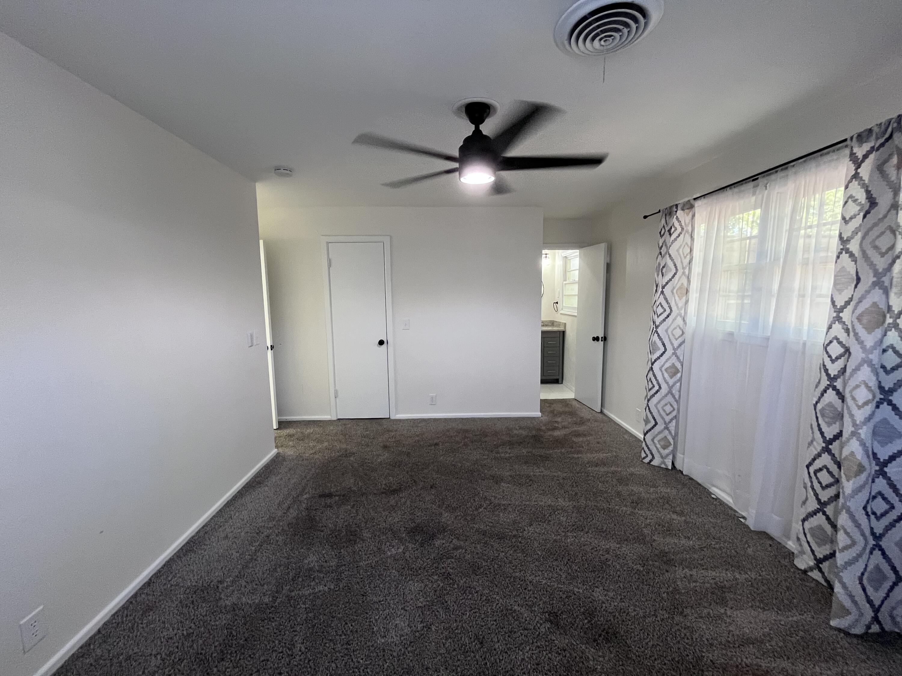 3612 55th Street Lubbock, TX 79413 - Photo 15 of 28 a view of an empty room and a ceiling fan