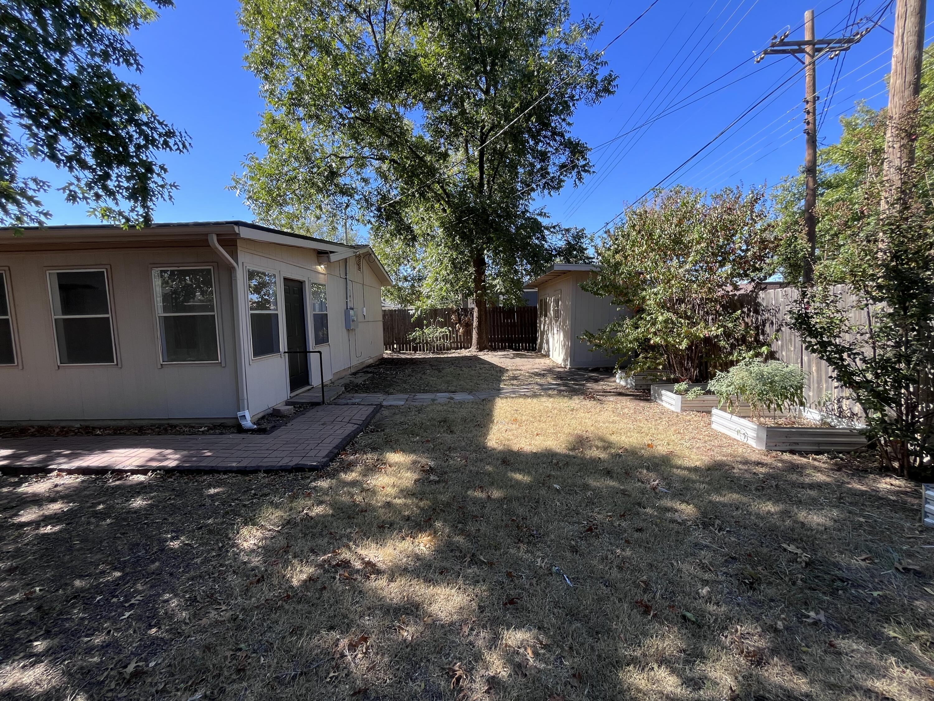 3612 55th Street Lubbock, TX 79413 - Photo 26 of 28 a view of a house with a yard
