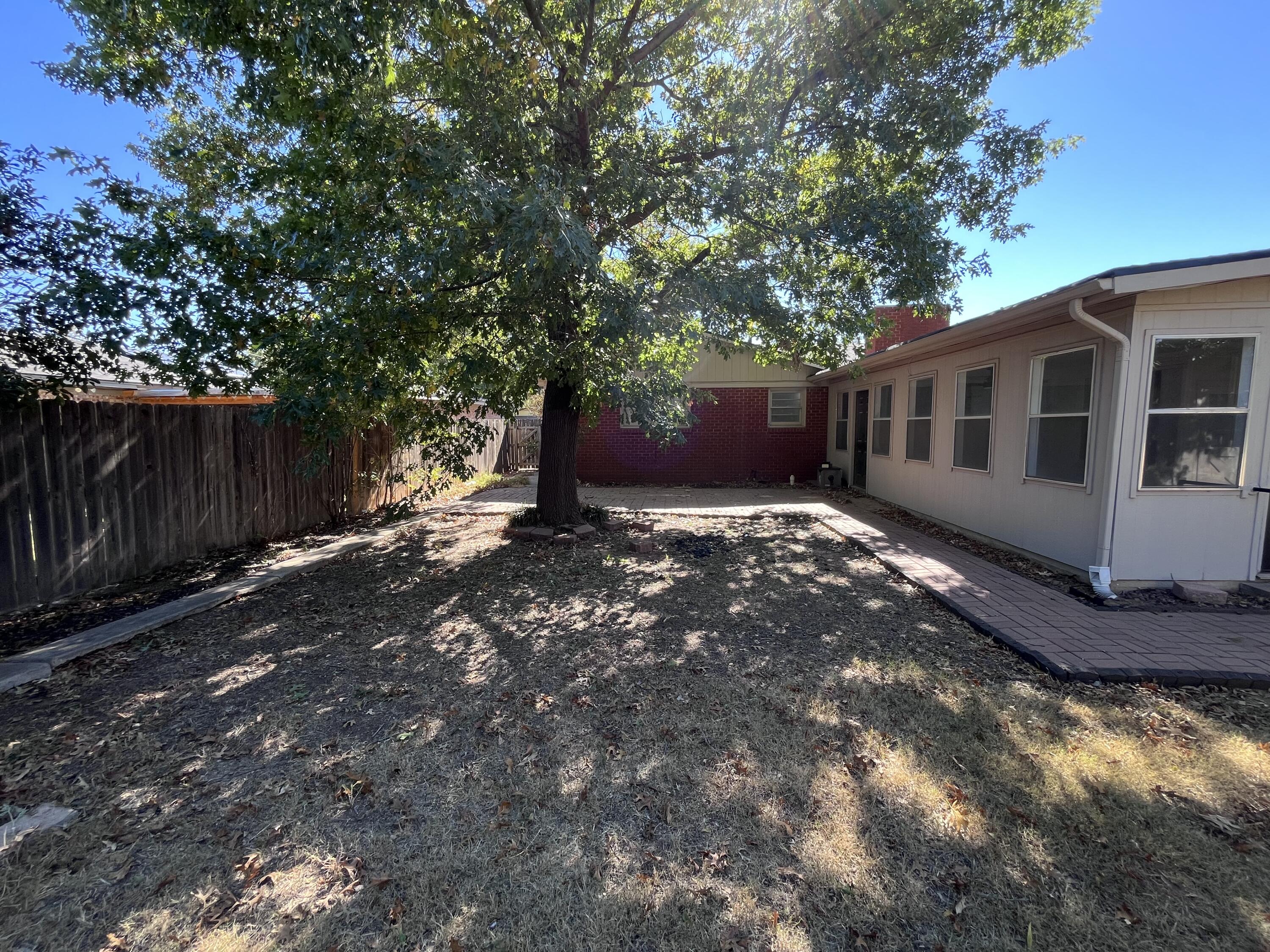 3612 55th Street Lubbock, TX 79413 - Photo 27 of 28 a view of a house with a yard