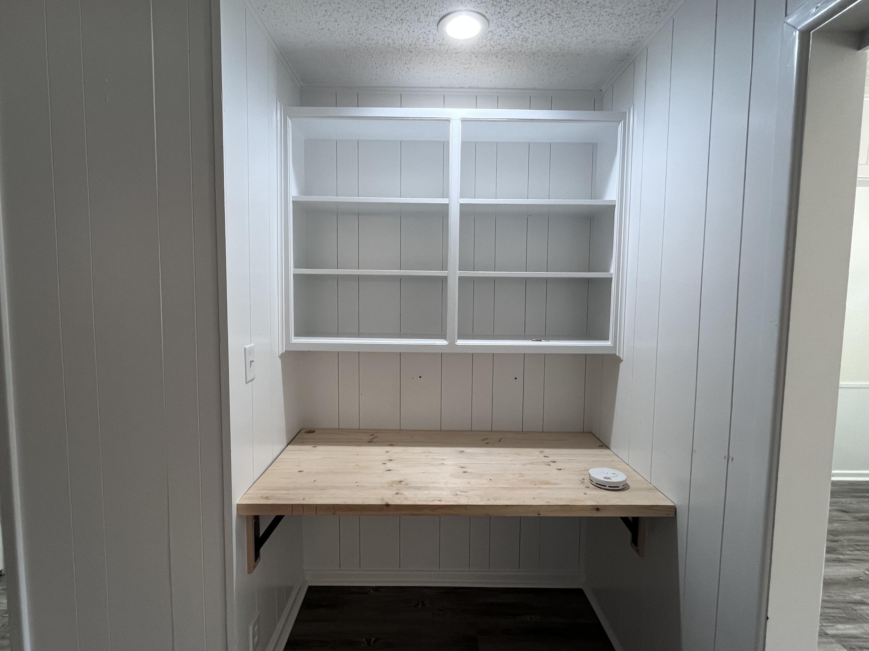 3612 55th Street Lubbock, TX 79413 - Photo 7 of 28 a room with a table and a shelf