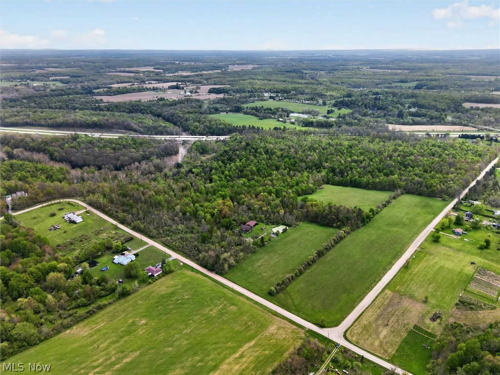 1526 Stevenson Road Ashtabula, OH 44004 - Photo 49 of 50 Expansive aerial view showcasing verdant green fields and mature tree lines