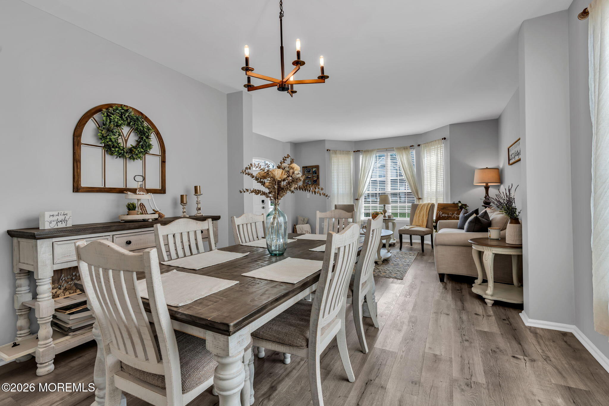 12 Lancaster Way Jackson, NJ 08527 - Photo 13 of 54 a view of a dining room with furniture window and wooden floor
