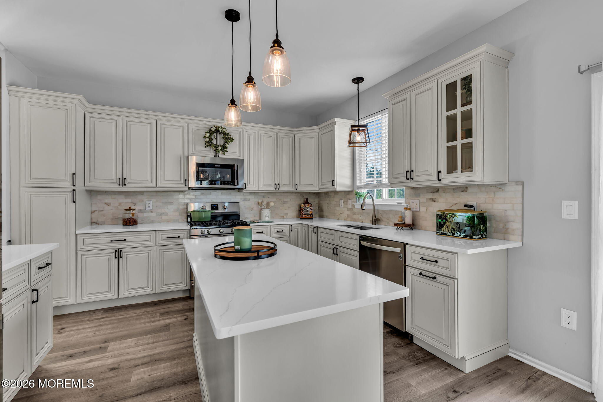 12 Lancaster Way Jackson, NJ 08527 - Photo 19 of 54 a kitchen with a sink white cabinets and white appliances