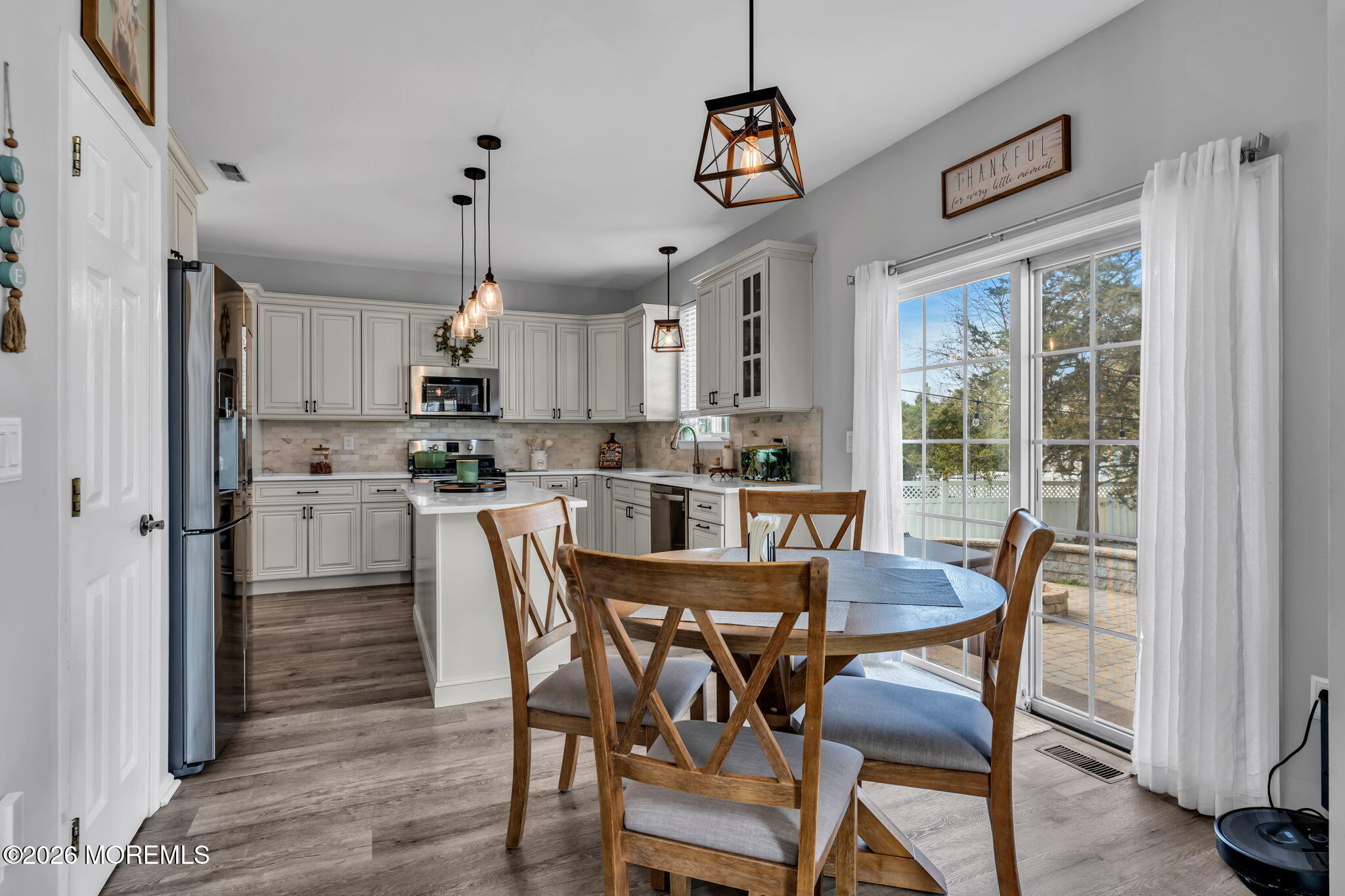 12 Lancaster Way Jackson, NJ 08527 - Photo 20 of 54 a view of a dining room with furniture large window and wooden floor
