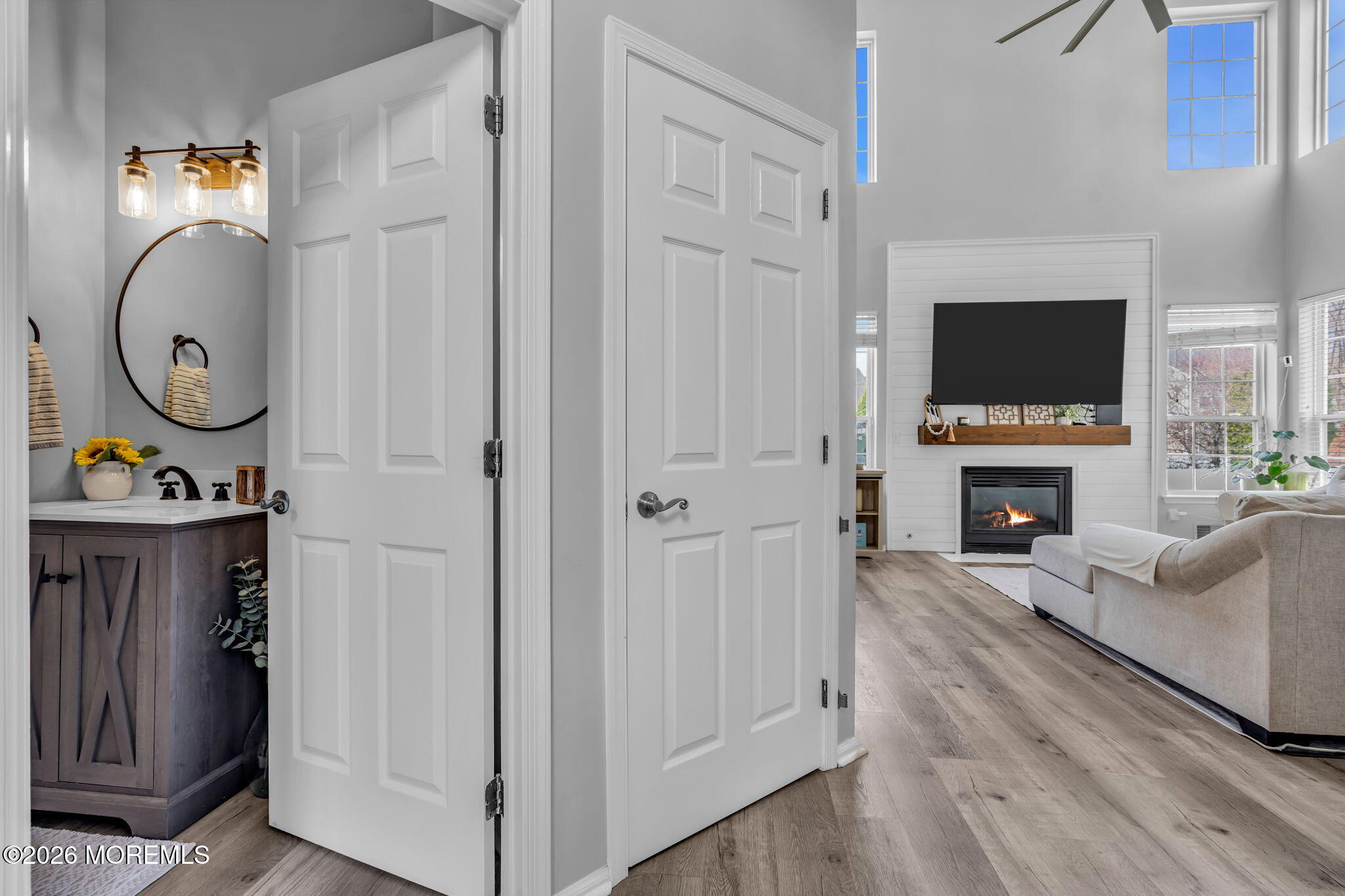 12 Lancaster Way Jackson, NJ 08527 - Photo 28 of 54 a living room with furniture a fireplace and a flat screen tv