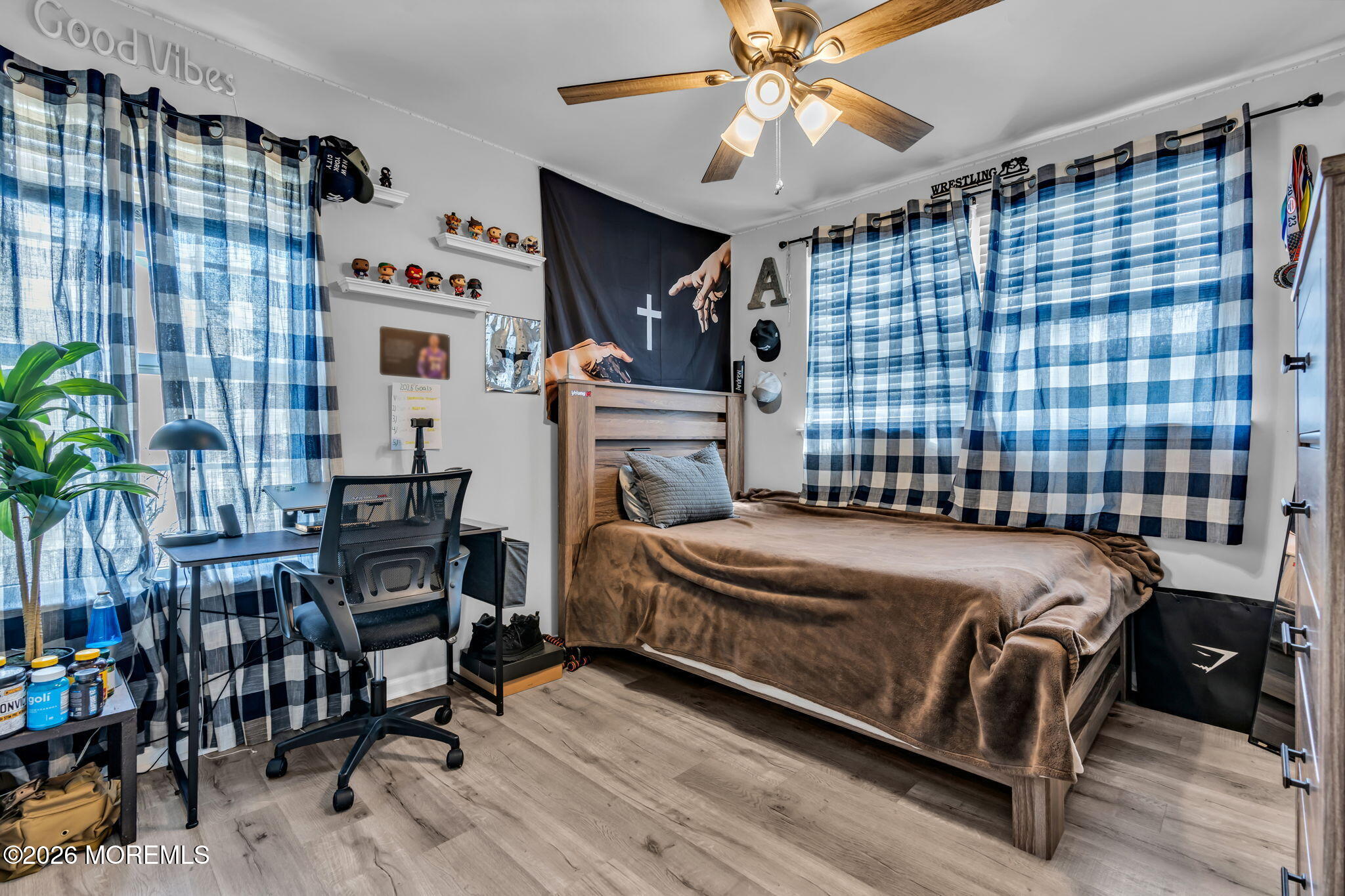 12 Lancaster Way Jackson, NJ 08527 - Photo 32 of 54 a bedroom with a bed and a chandelier