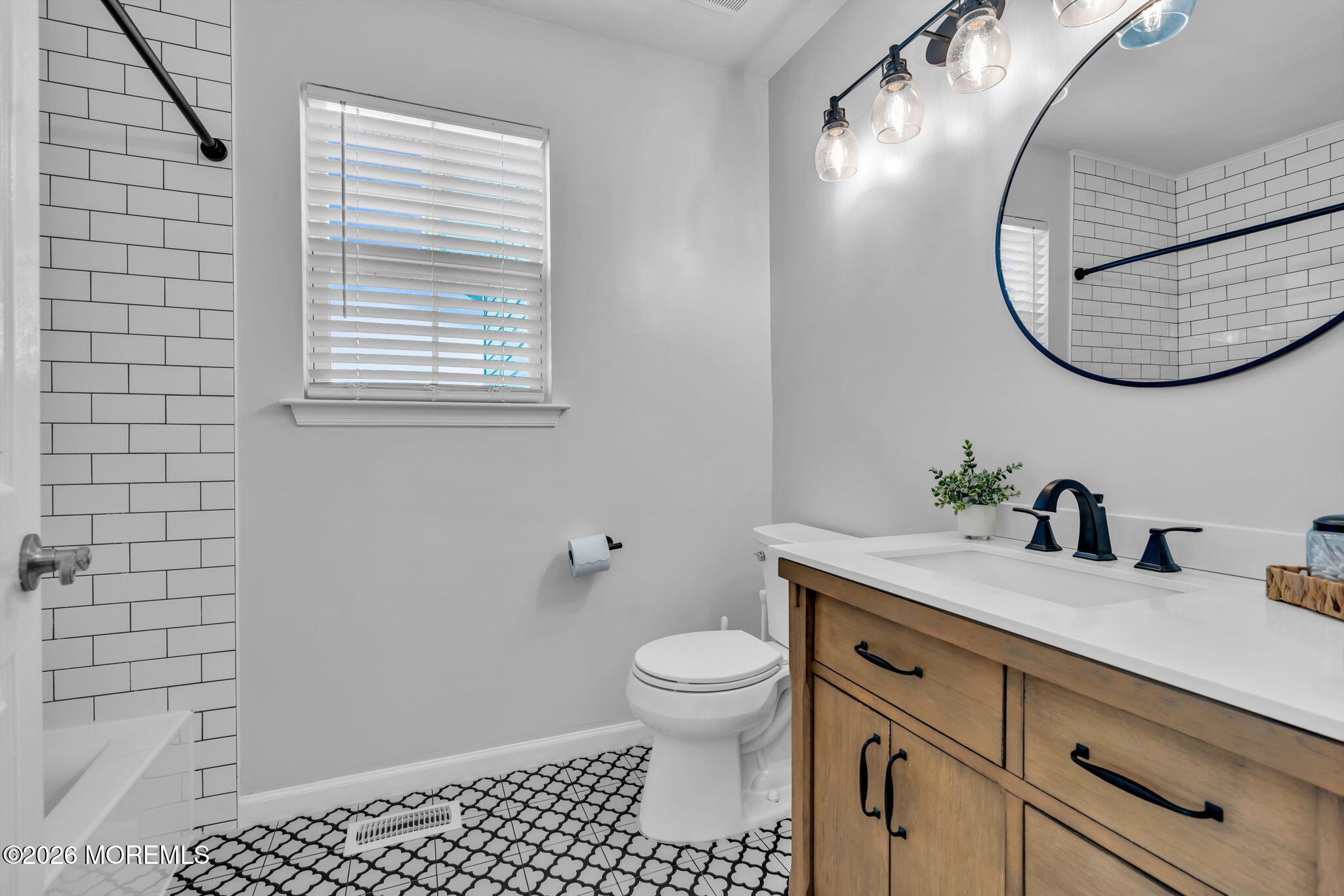 12 Lancaster Way Jackson, NJ 08527 - Photo 33 of 54 a bathroom with a granite countertop sink a toilet and a mirror