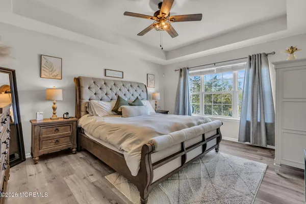 a bed room with a bed and a television
