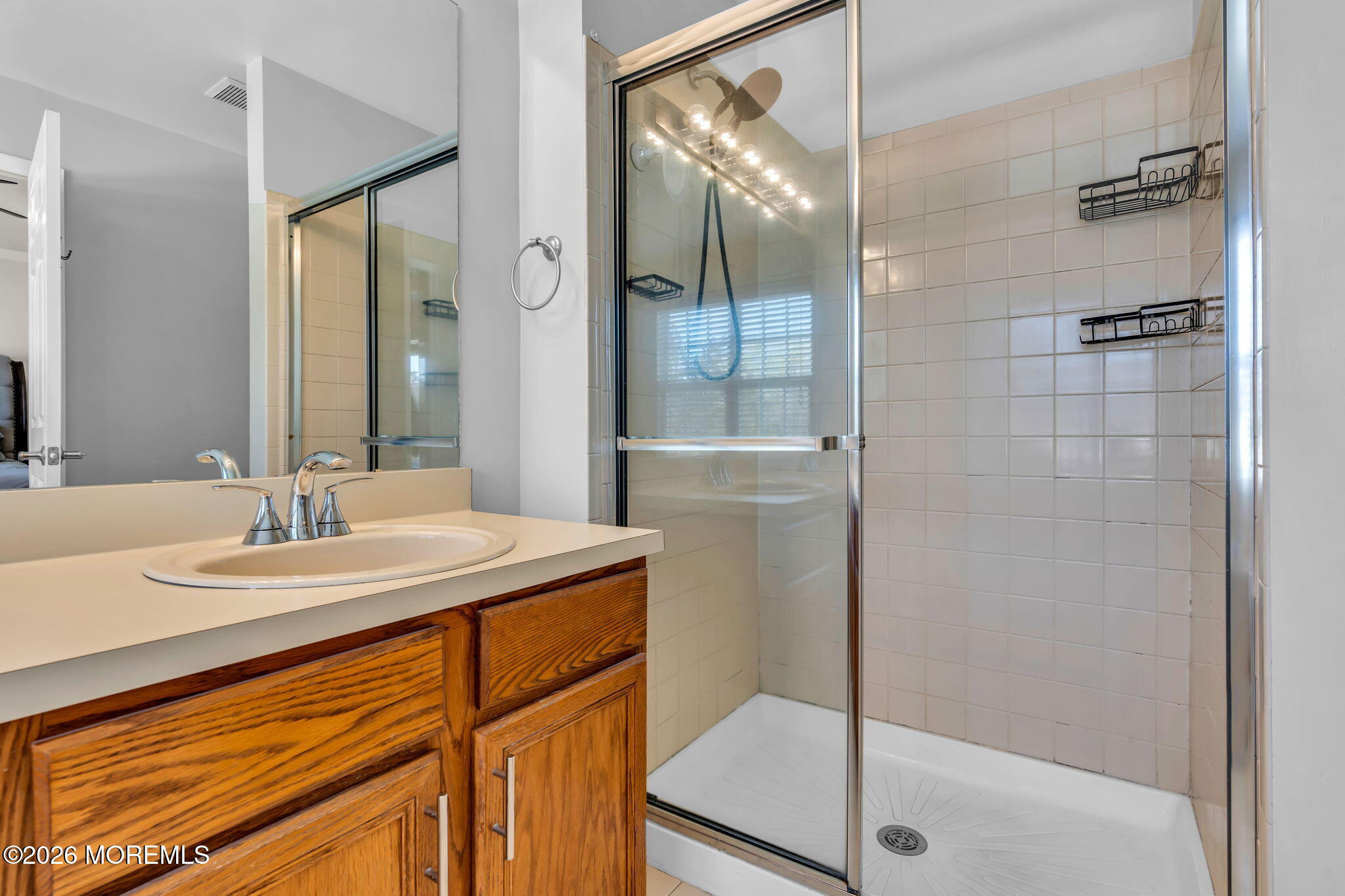 12 Lancaster Way Jackson, NJ 08527 - Photo 38 of 54 a bathroom with a sink and a mirror
