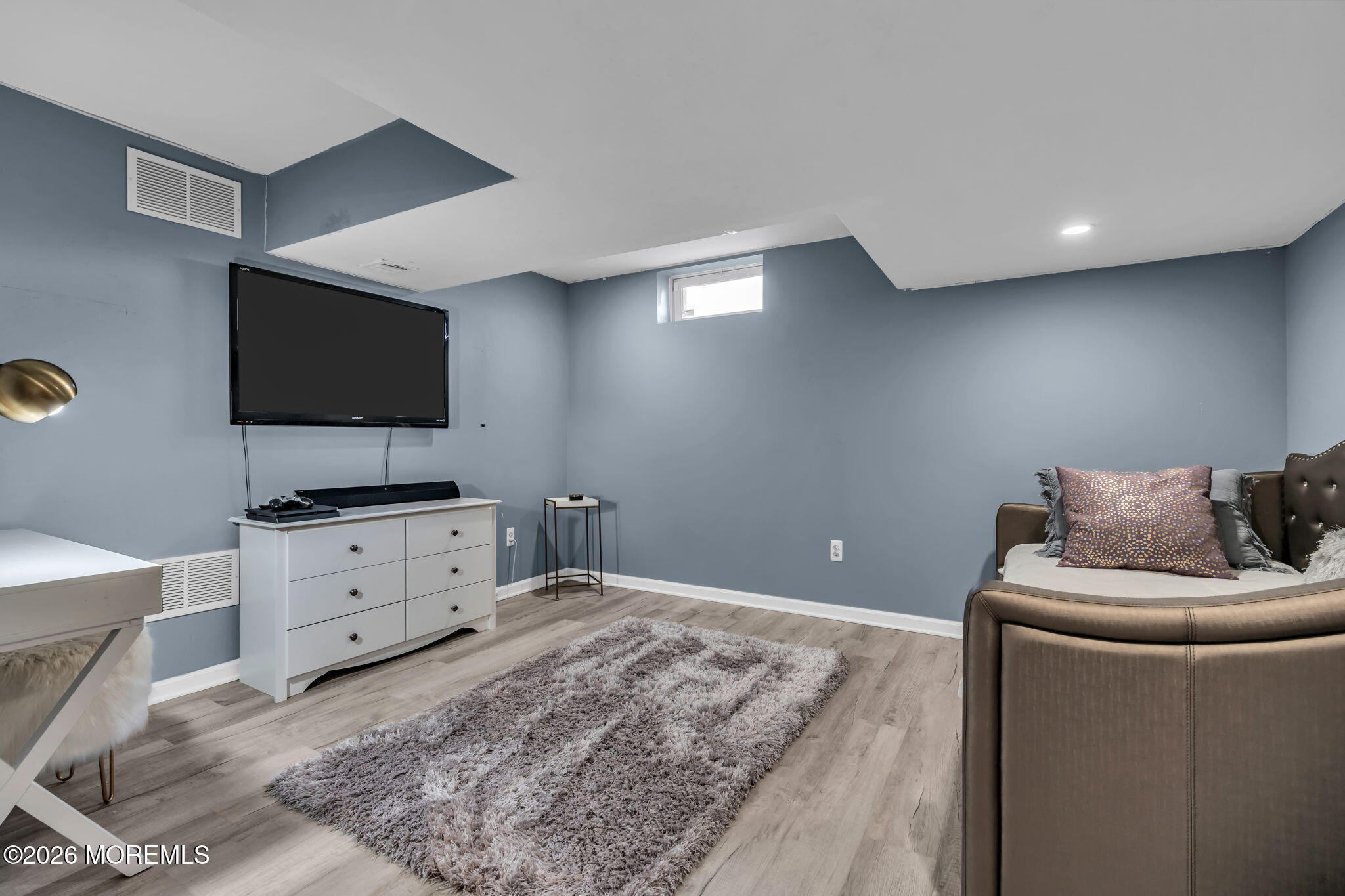 12 Lancaster Way Jackson, NJ 08527 - Photo 40 of 54 a living room with furniture and a flat screen tv