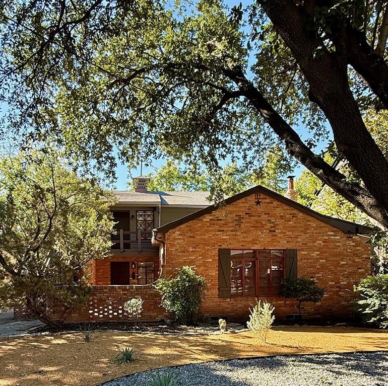 3610 Springbrook Street Dallas, TX 75205 - Photo 1 of 1 a front view of a house with a yard
