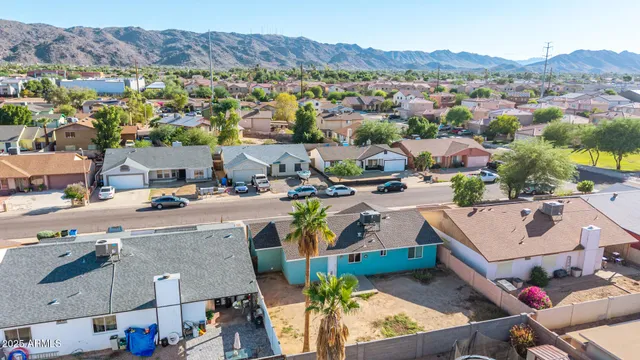 an aerial view of residential houses with outdoor space