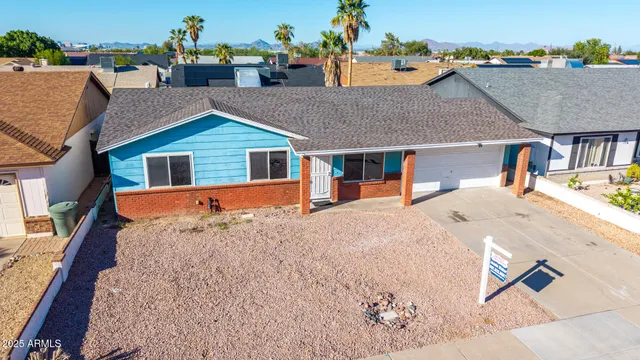 an aerial view of a house with swimming pool
