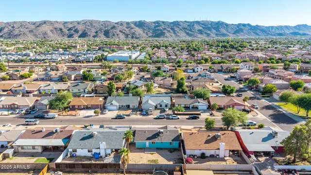 an aerial view of residential houses and outdoor space