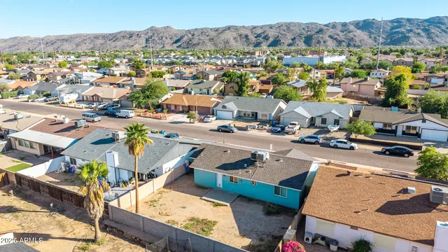 an aerial view of a house with a swimming pool