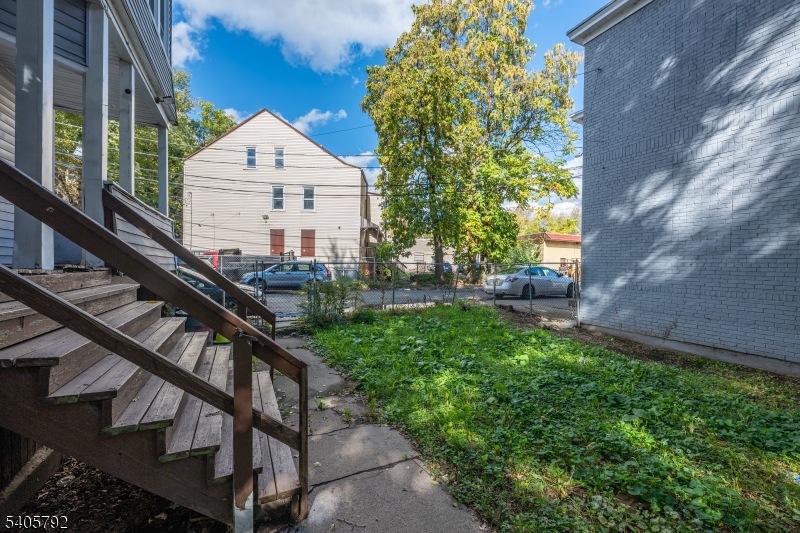 156 East Main Street Paterson, NJ 07522 - Photo 25 of 25 a view of a house with a yard