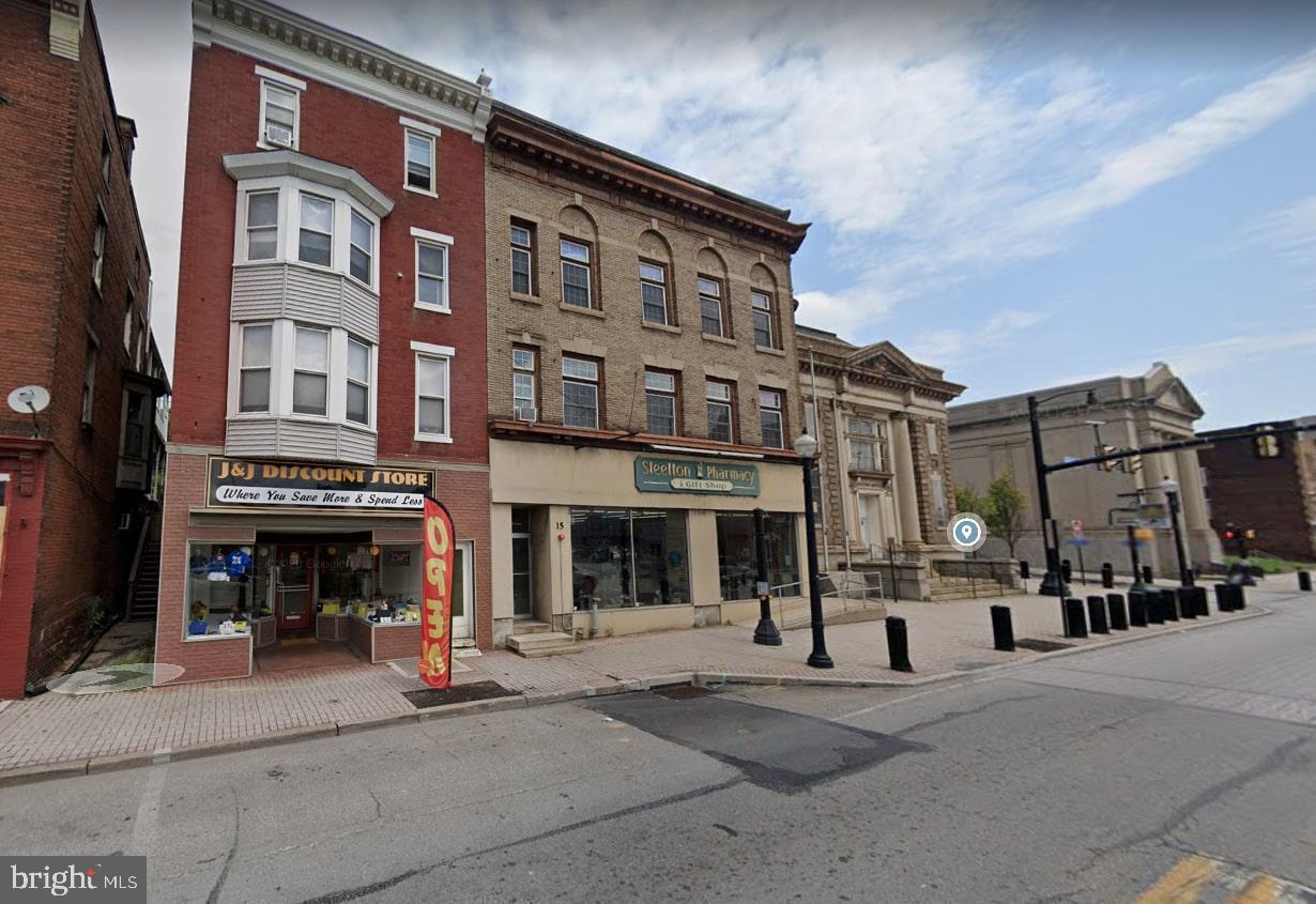 a front view of a building with street