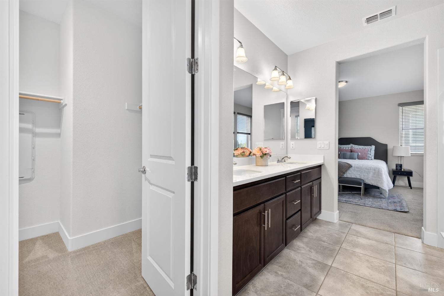 1273 Del Rancho Way Petaluma, CA 94954 - Photo 12 of 25 a en suite bathroom with a sink double vanity and a mirror