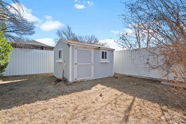 a view of a backyard of the house