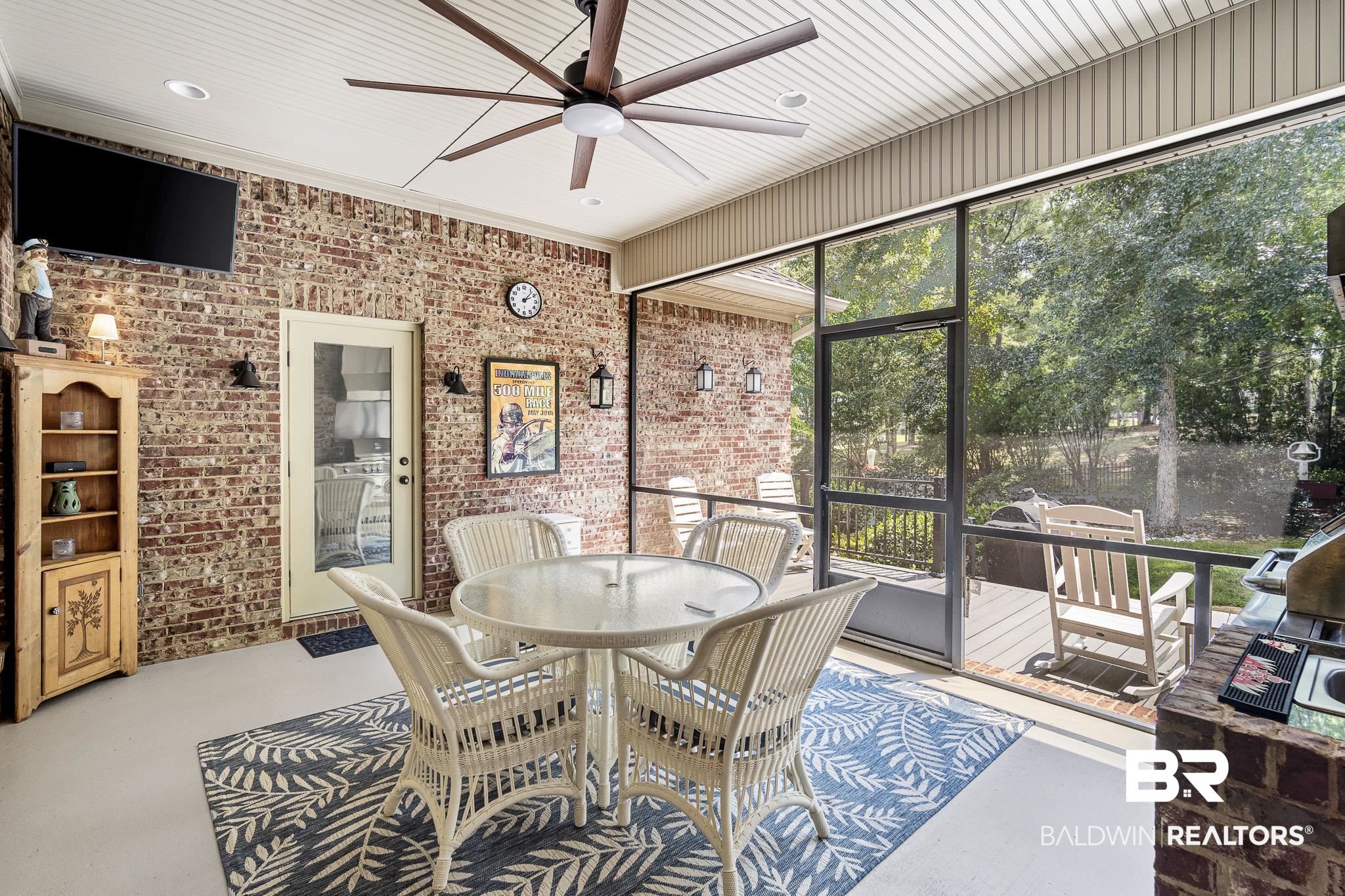 7090 Carson Lane Daphne, AL 36527 - Photo 28 of 37 Sunroom with ceiling fan and a healthy amount of sunlight