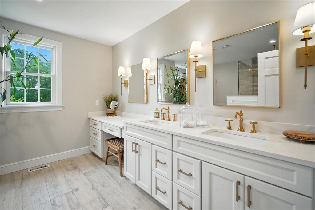 879 Russell Avenue Suffield, CT 06078 - Photo 24 of 40 a spacious bathroom with double sink a mirror and a window