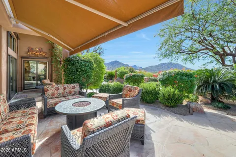 a view of swimming pool with outdoor seating