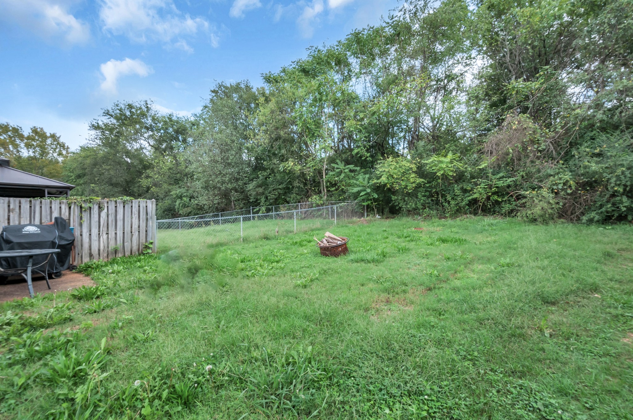 1418 Bell Trace Drive Antioch, TN 37013 - Photo 16 of 16 a backyard of a house with table and chairs