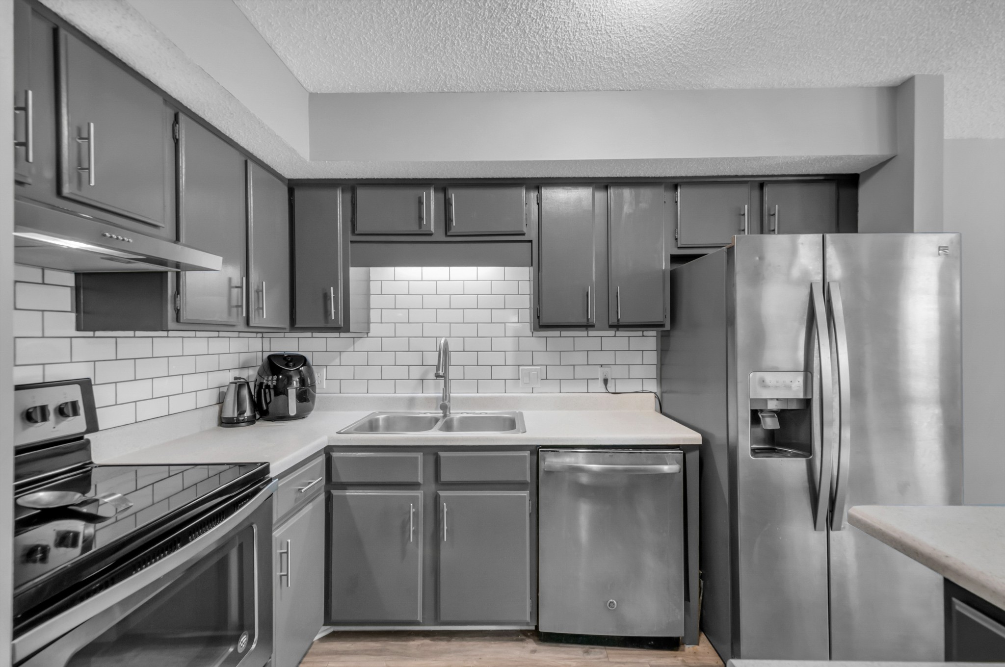 1418 Bell Trace Drive Antioch, TN 37013 - Photo 6 of 16 a kitchen with stainless steel appliances granite countertop a refrigerator a sink and a stove