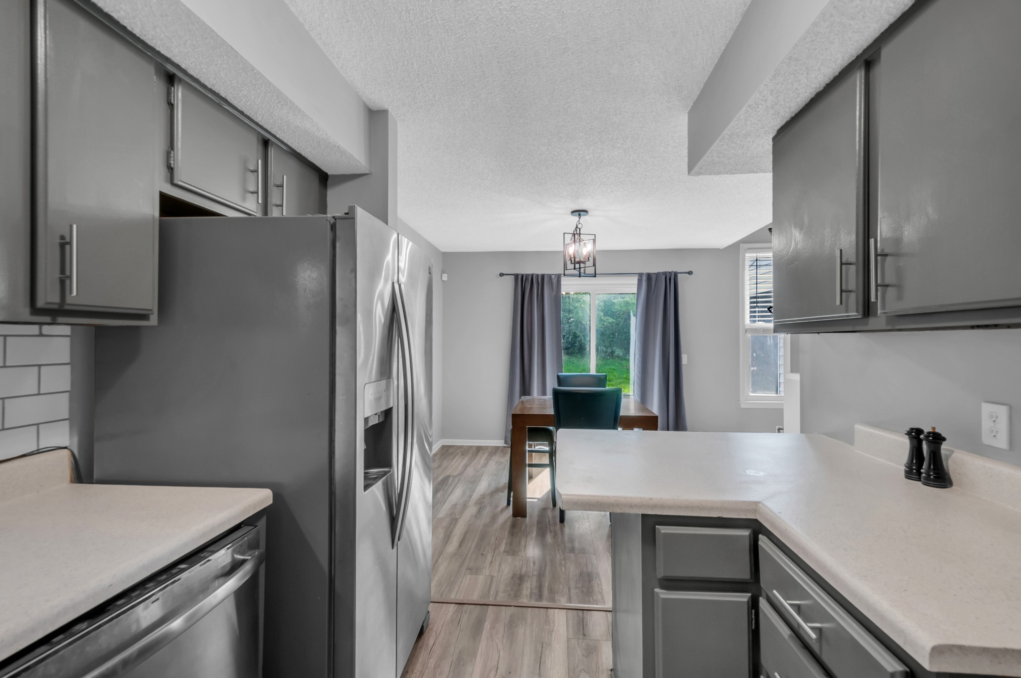1418 Bell Trace Drive Antioch, TN 37013 - Photo 7 of 16 a kitchen with stainless steel appliances granite countertop a refrigerator a sink and a stove