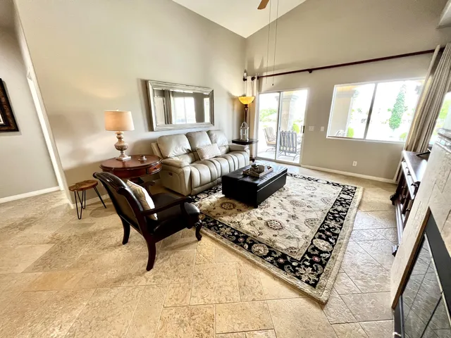 a living room with furniture and a rug