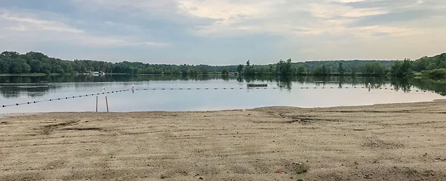 a view of a yard with wooden floor and lake view
