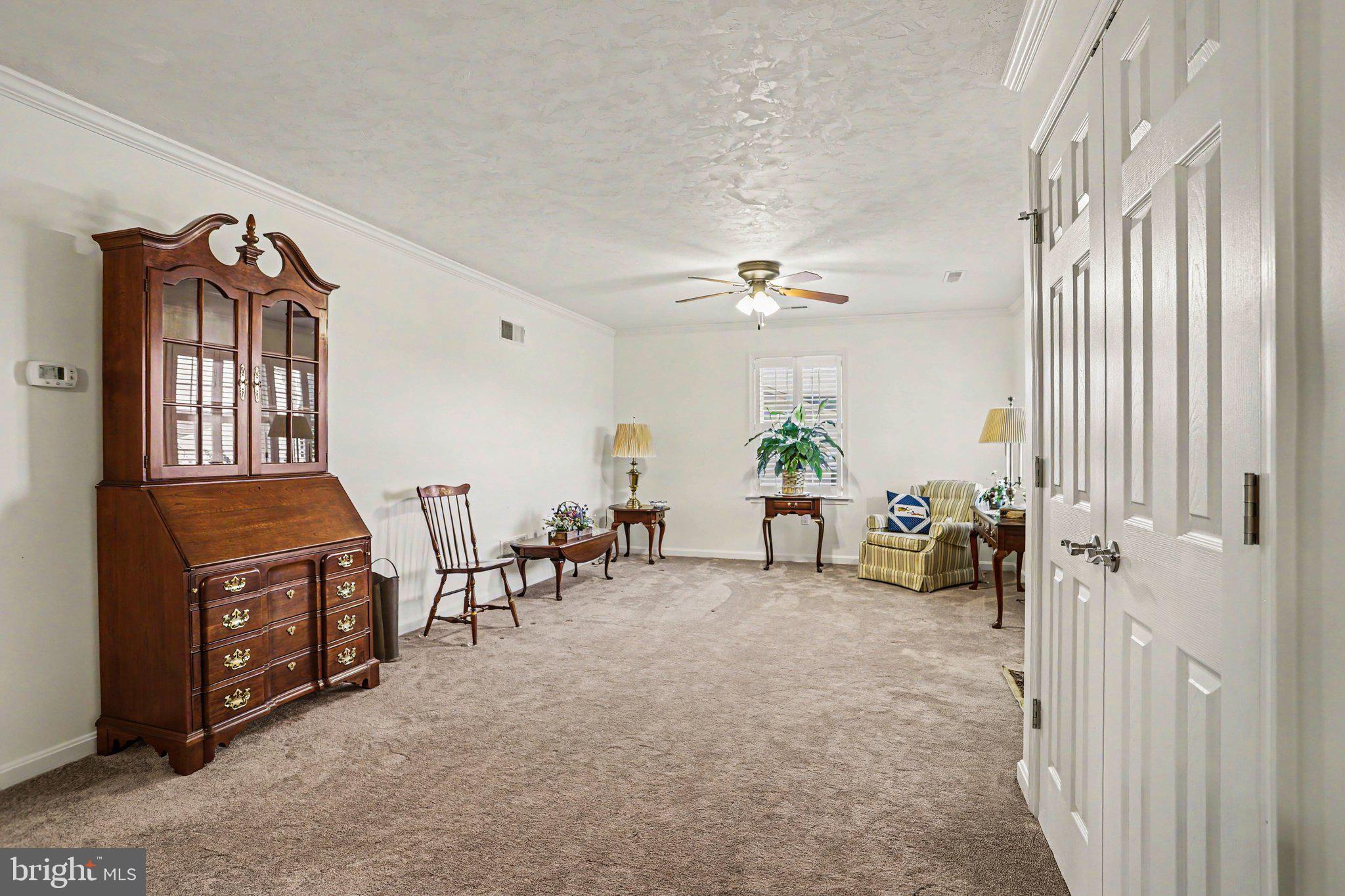 1371 Chami Drive, Unit 166 Spring Grove, PA 17362 - Photo 8 of 28 a view of a livingroom with furniture and a garage