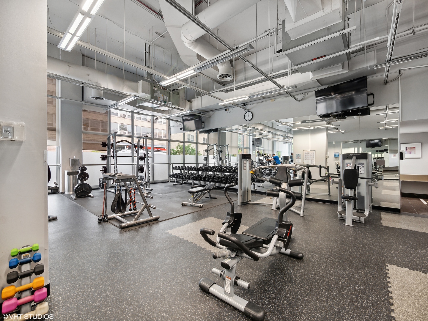 655 West Irving Park Road, Unit 2303 Chicago, IL 60613 - Photo 12 of 13 a view of a room with gym equipment