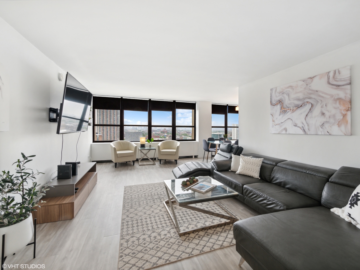 655 West Irving Park Road, Unit 2303 Chicago, IL 60613 - Photo 2 of 13 a living room with furniture and a large window