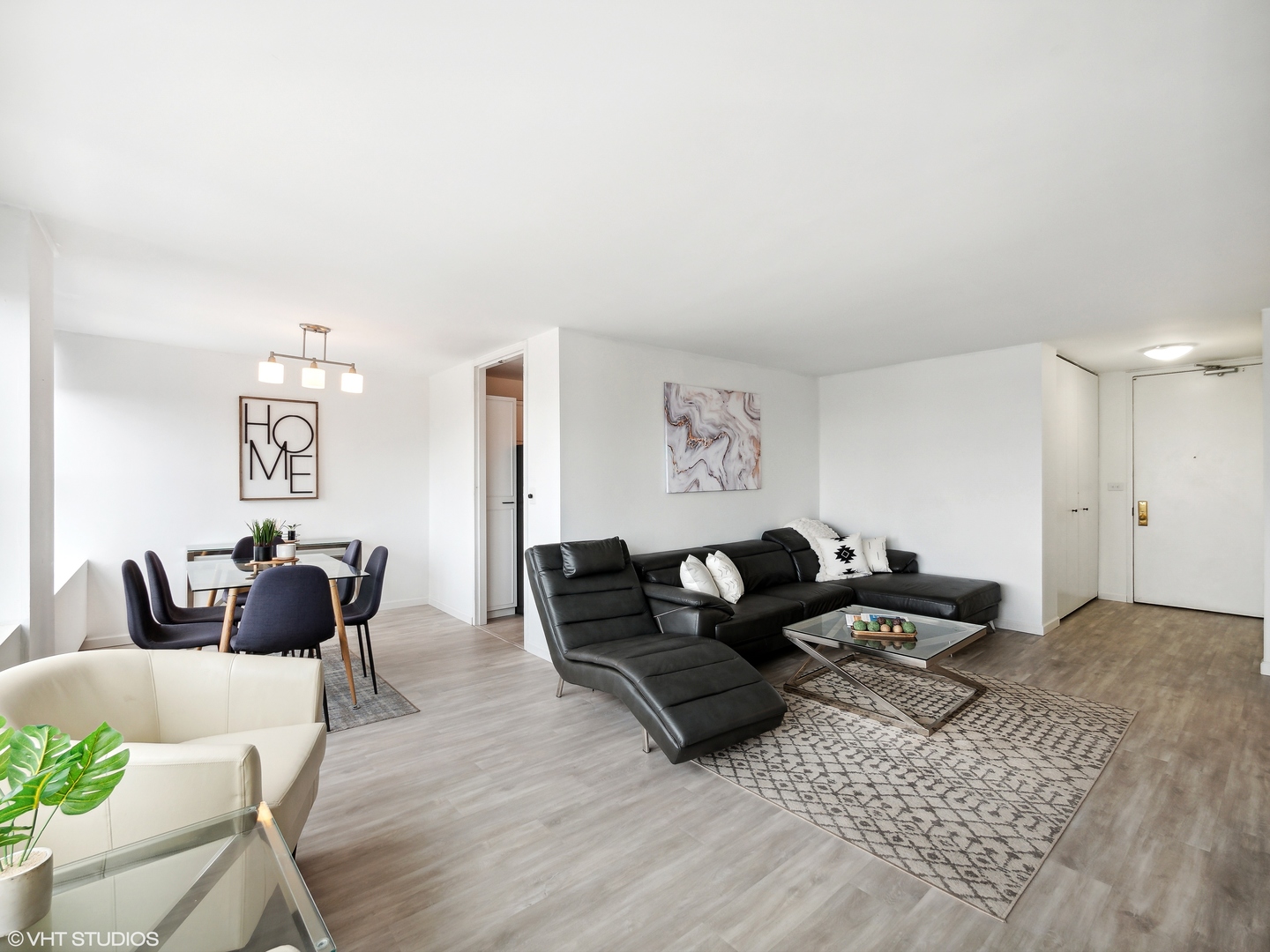 655 West Irving Park Road, Unit 2303 Chicago, IL 60613 - Photo 4 of 13 a living room with furniture