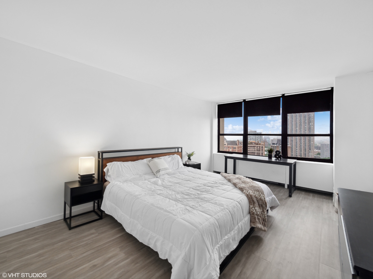 655 West Irving Park Road, Unit 2303 Chicago, IL 60613 - Photo 7 of 13 a bedroom with a bed and a window