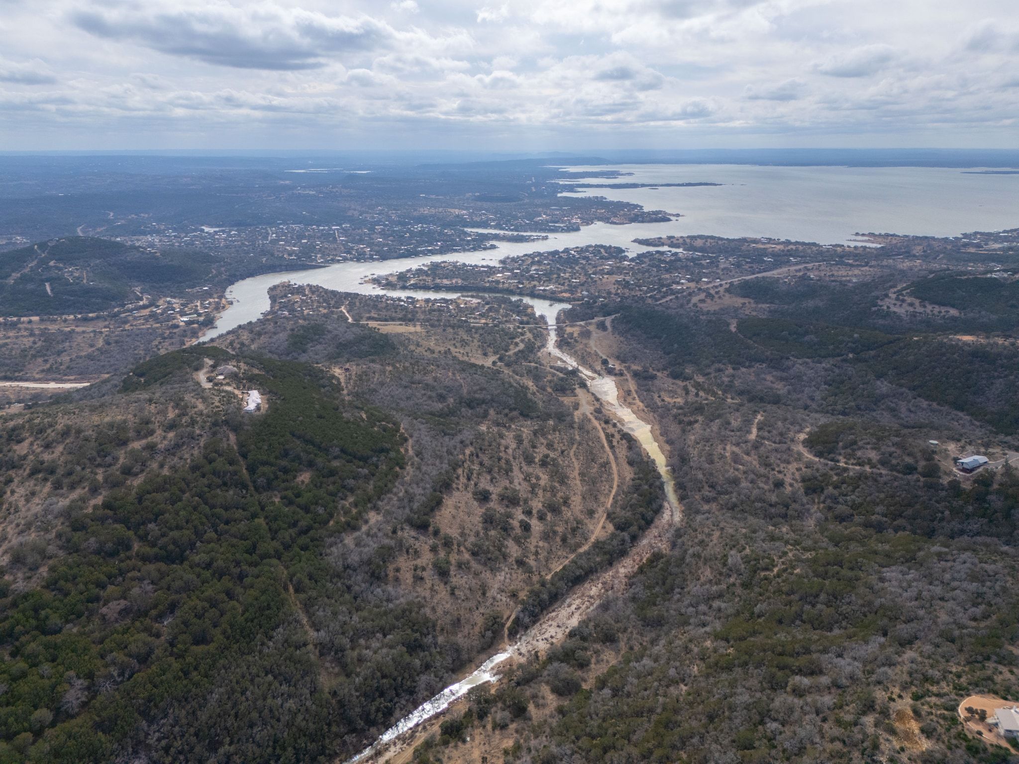 2551 Wolf Creek Ranch Road Burnet, TX 78611 - Photo 33 of 40 Aerial view of property and surrounding area featuring a large body of water