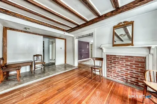 a view of an entryway with wooden floor