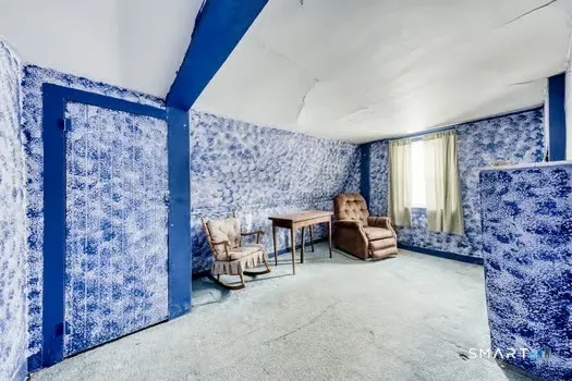 a room with a bed and a window